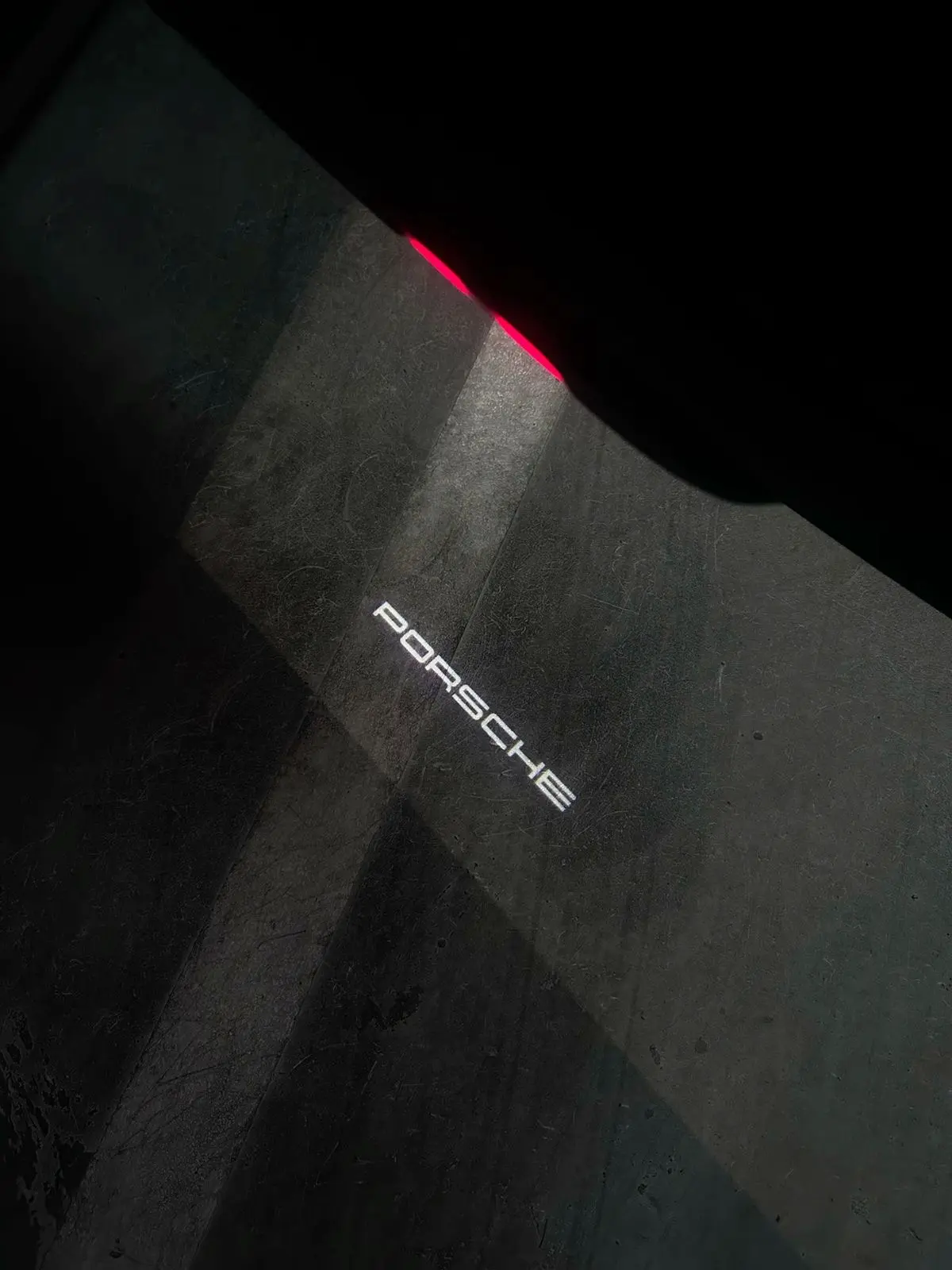 Porsche welcome light projected onto the ground