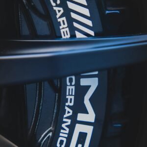 Close-up of Mercedes-AMG carbon ceramic brake caliper and drilled brake disc