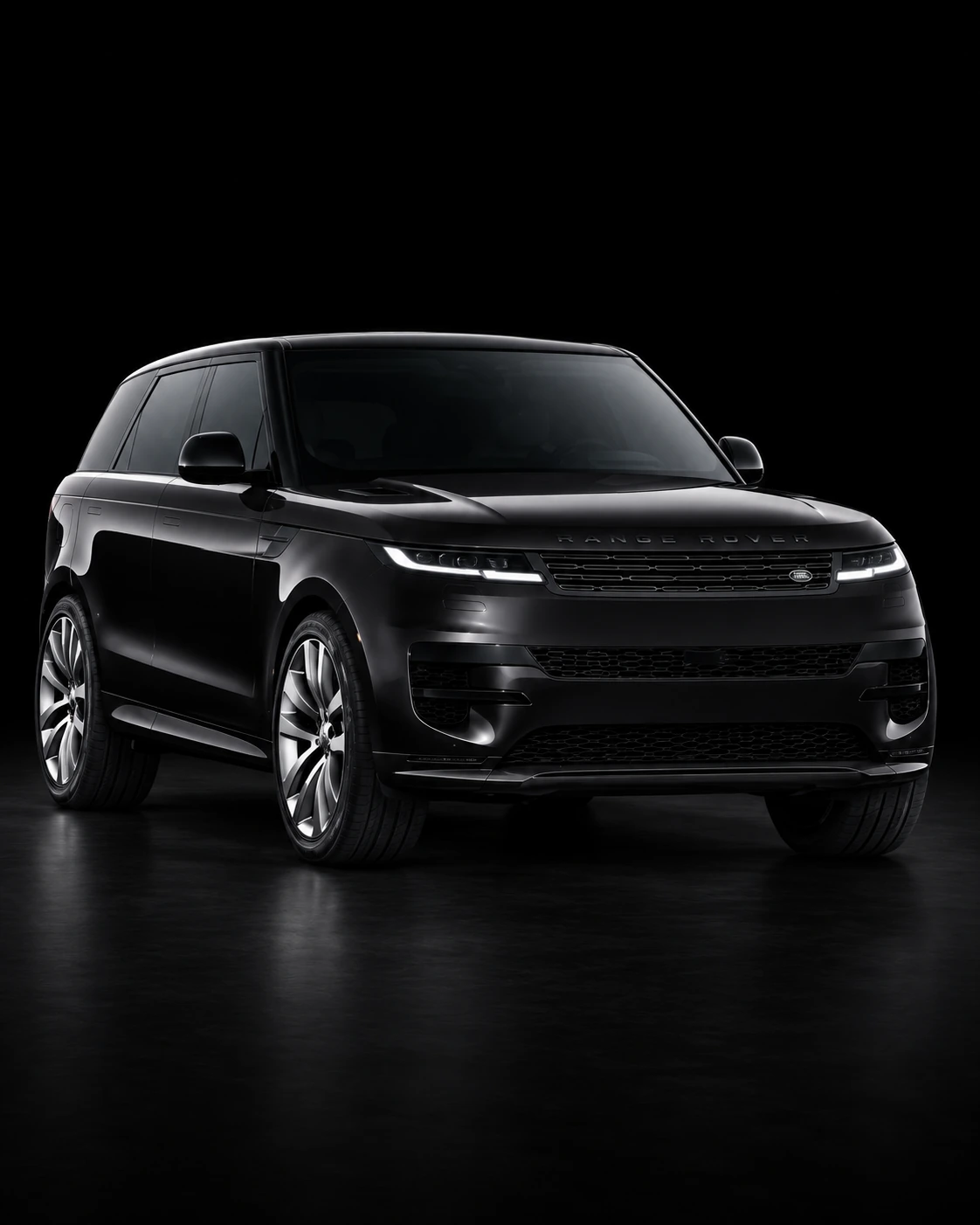 Black Range Rover Sport in a black studio